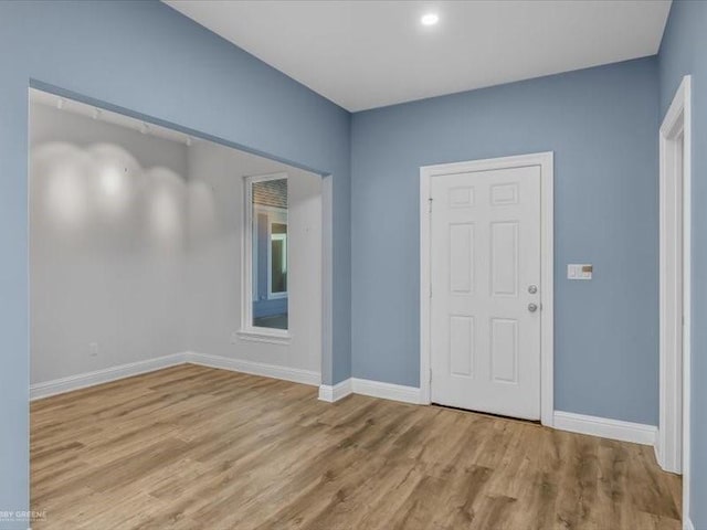 empty room with light wood-type flooring