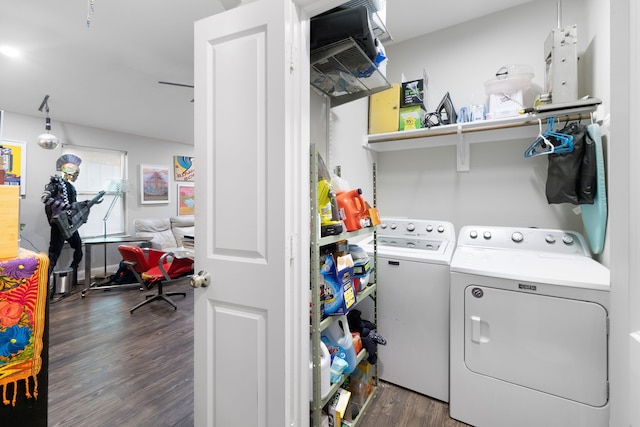 laundry room with dark wood-type flooring and washing machine and clothes dryer