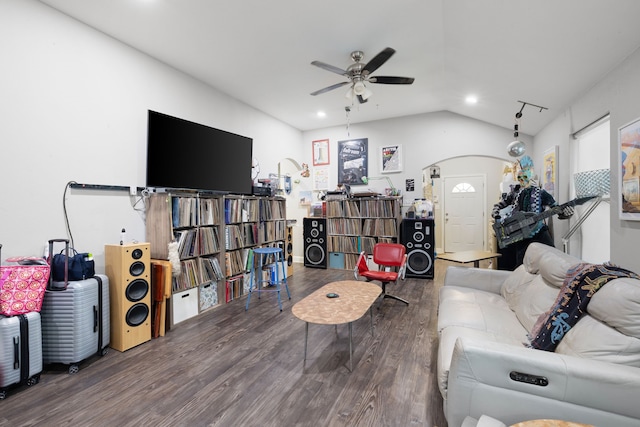 living room featuring hardwood / wood-style floors, vaulted ceiling, and ceiling fan