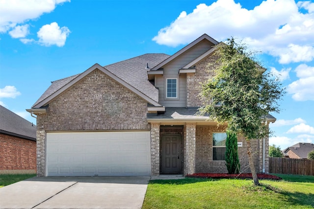 view of front facade with a front yard and a garage