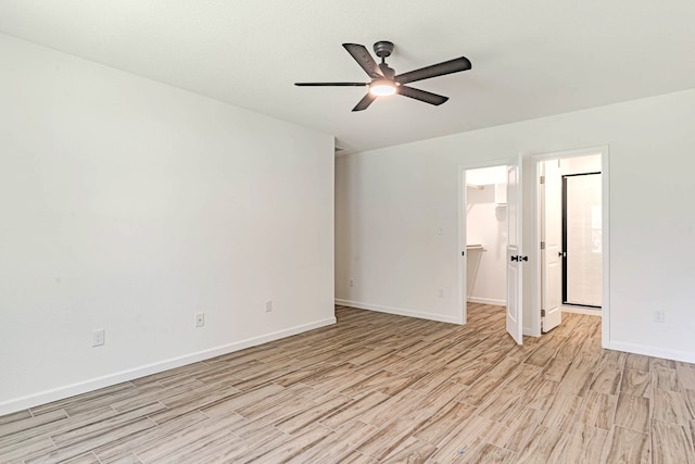 unfurnished room with light hardwood / wood-style flooring and ceiling fan