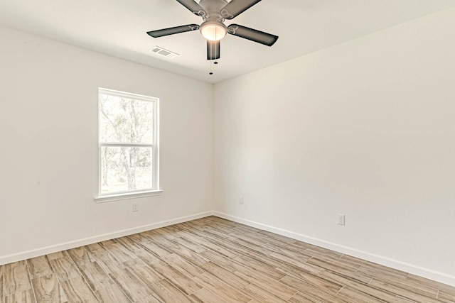 unfurnished room featuring ceiling fan and light hardwood / wood-style flooring