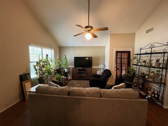 living room featuring dark wood-type flooring, high vaulted ceiling, and ceiling fan