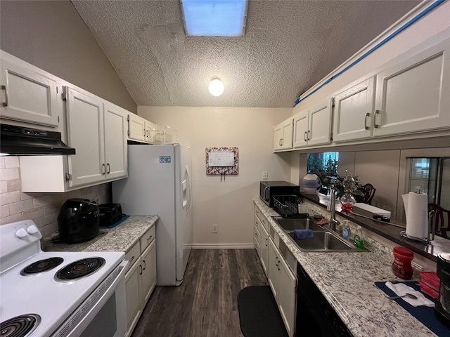 kitchen featuring white appliances, vaulted ceiling, sink, white cabinets, and a textured ceiling