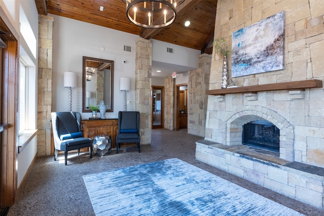 living room featuring a fireplace, high vaulted ceiling, wooden ceiling, and an inviting chandelier