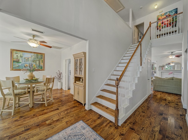 stairs with hardwood / wood-style floors