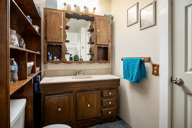 bathroom with vanity and toilet