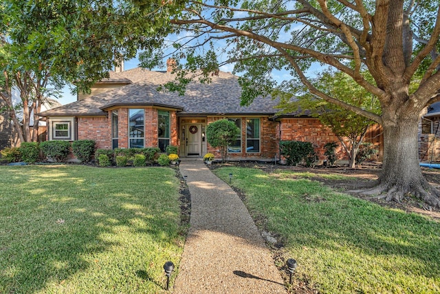 single story home featuring a front yard