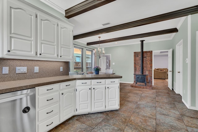 kitchen with a wood stove, backsplash, stainless steel dishwasher, beamed ceiling, and white cabinetry