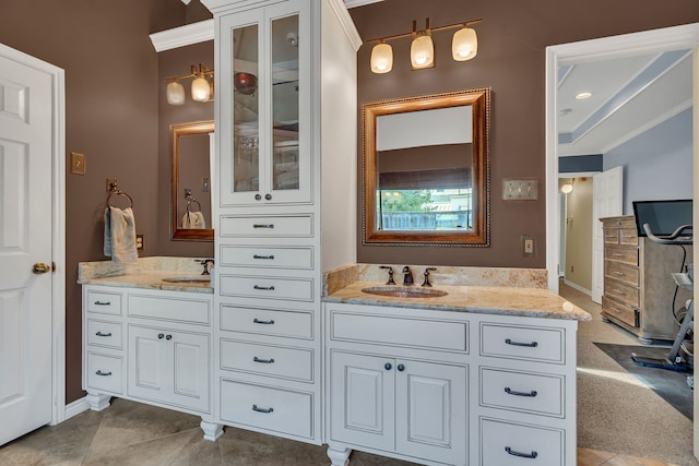 bathroom with tile patterned flooring, vanity, and crown molding