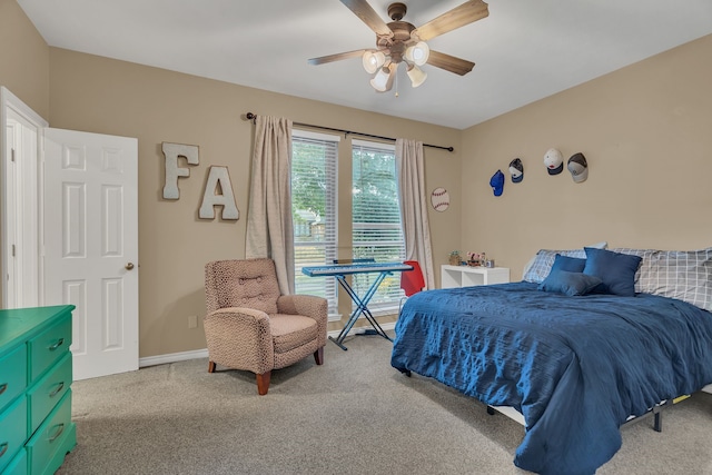 carpeted bedroom featuring ceiling fan