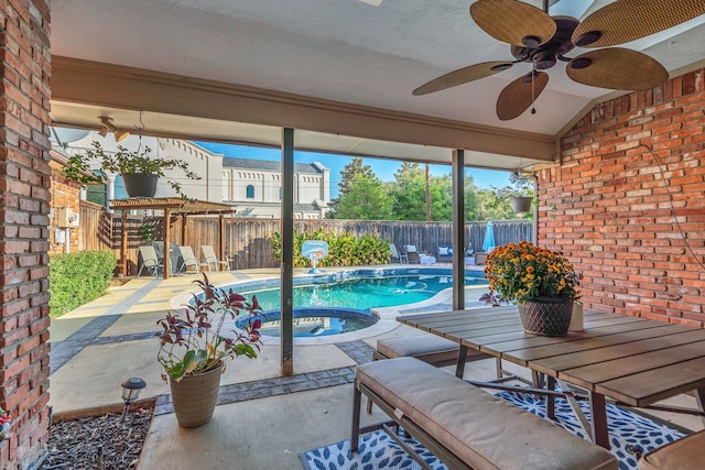 view of swimming pool with a patio area, an in ground hot tub, and ceiling fan