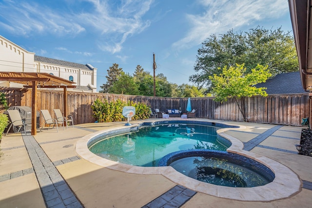 view of pool featuring a patio area and an in ground hot tub