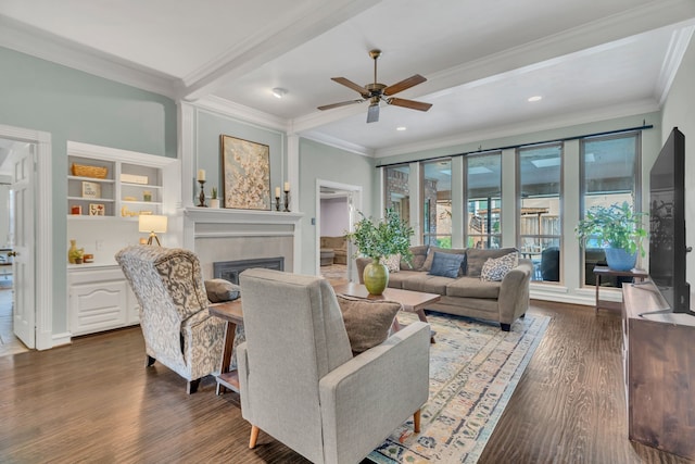 living room with ceiling fan, dark hardwood / wood-style flooring, and crown molding