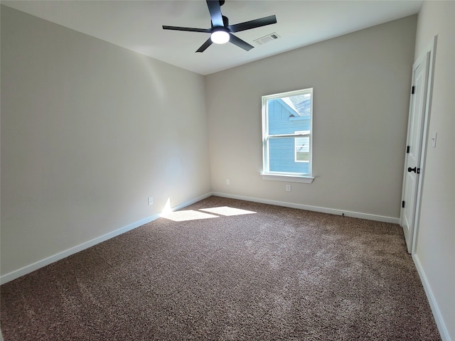 unfurnished room with ceiling fan and carpet flooring