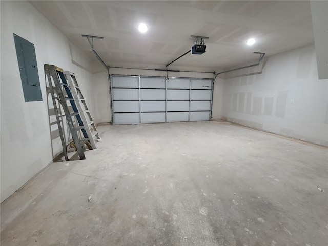 garage featuring a garage door opener and electric panel