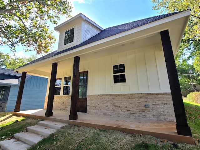 exterior space featuring a garage and a porch