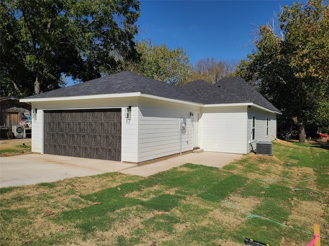 view of home's exterior featuring a lawn and central AC unit