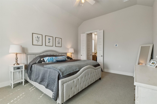 bedroom featuring light carpet, baseboards, and lofted ceiling