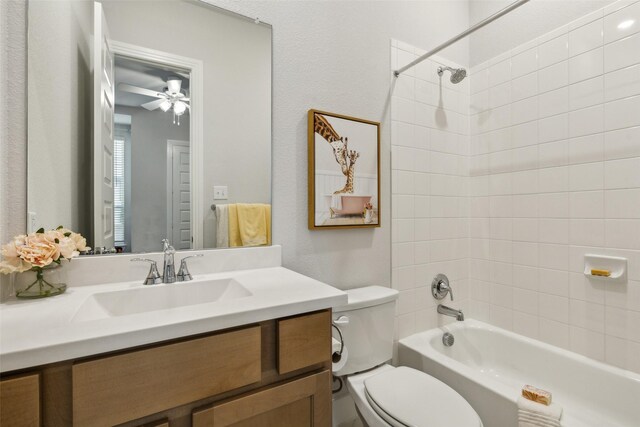 full bath featuring shower / bath combination, vanity, toilet, and a ceiling fan