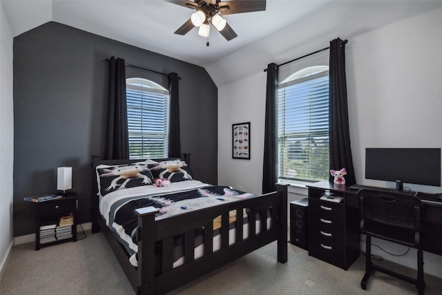 bedroom featuring a ceiling fan, light carpet, and vaulted ceiling