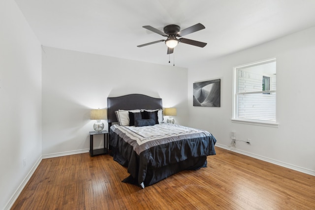 bedroom featuring hardwood / wood-style flooring and ceiling fan