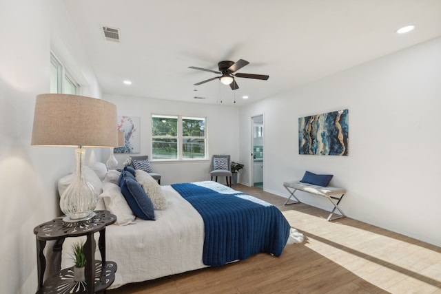 bedroom featuring hardwood / wood-style floors and ceiling fan