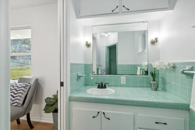 bathroom with vanity and hardwood / wood-style flooring