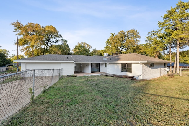 single story home with a patio and a front lawn