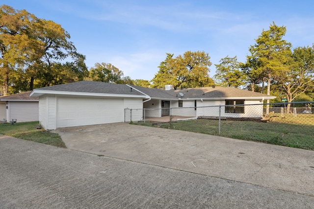 single story home with a front yard and a garage