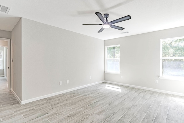 unfurnished room featuring ceiling fan and light wood-type flooring