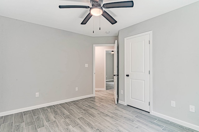 spare room with ceiling fan and light hardwood / wood-style flooring