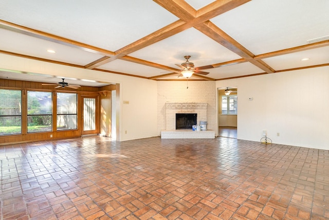 unfurnished living room featuring ceiling fan, beamed ceiling, coffered ceiling, and a brick fireplace