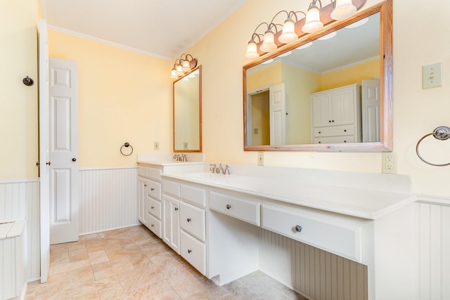 bathroom with vanity and crown molding