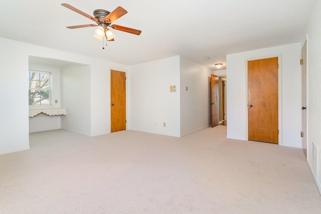 unfurnished room featuring ceiling fan and light colored carpet