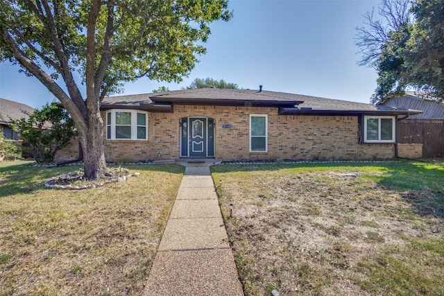 single story home with a front yard