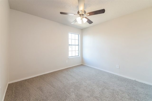 empty room featuring carpet floors, a textured ceiling, and ceiling fan