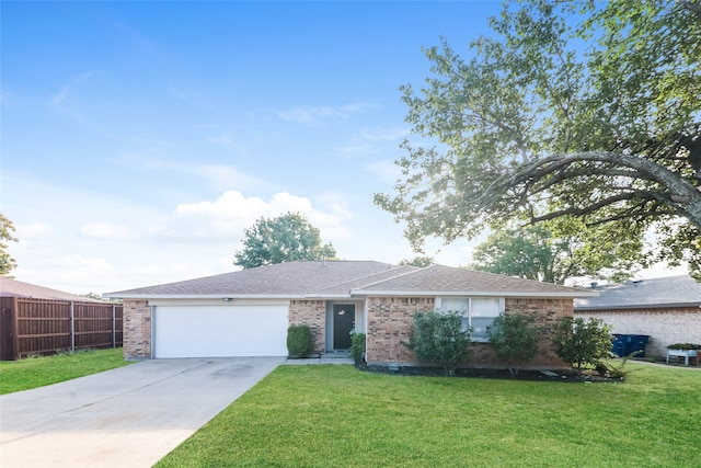 ranch-style home featuring a front lawn and a garage