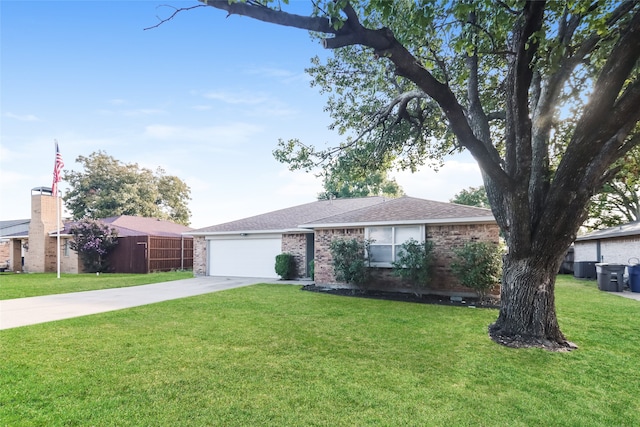 ranch-style home featuring a front yard and a garage