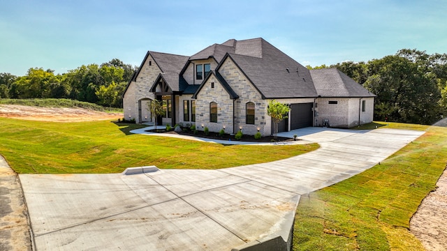 view of front of property with a garage and a front yard