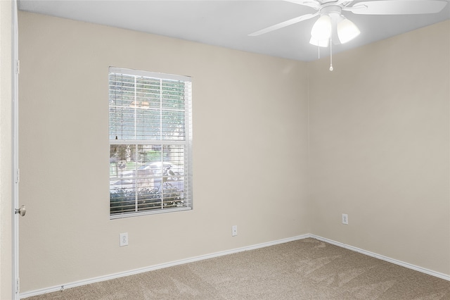 carpeted empty room with ceiling fan