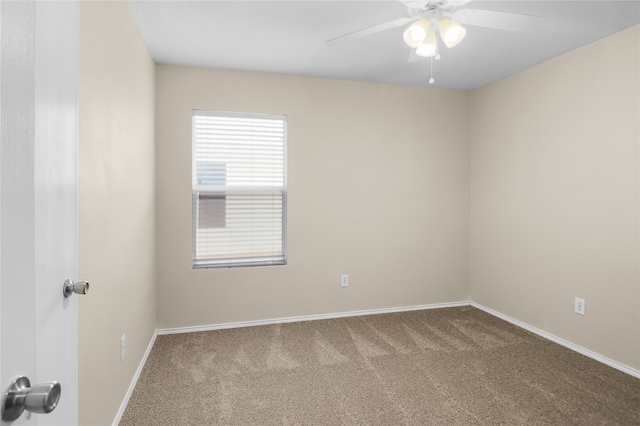 unfurnished room featuring ceiling fan and carpet flooring