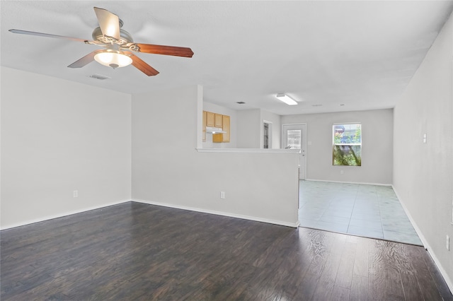 spare room featuring hardwood / wood-style flooring and ceiling fan