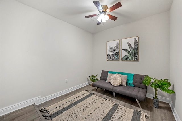 sitting room featuring ceiling fan and wood-type flooring