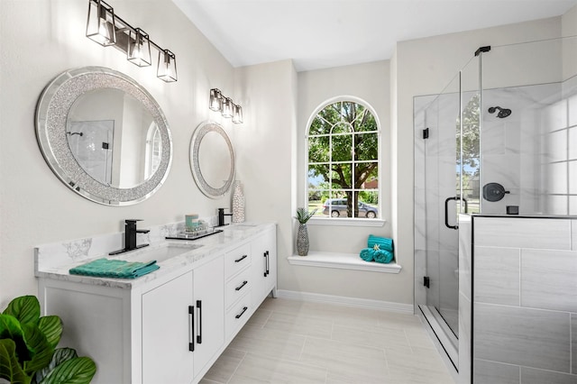 bathroom featuring vanity and an enclosed shower