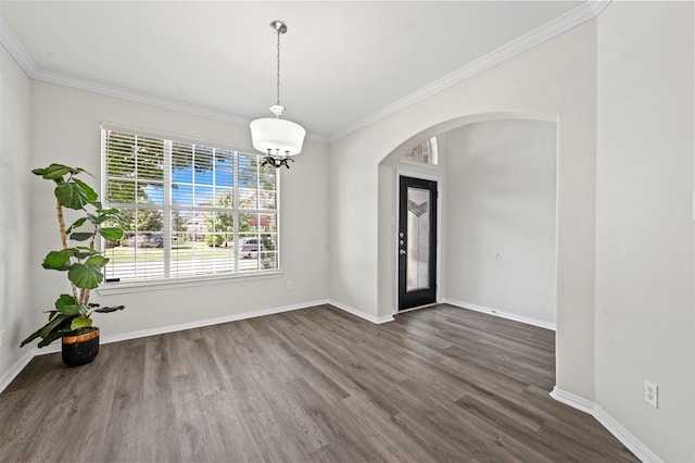 entrance foyer with ornamental molding and dark hardwood / wood-style floors