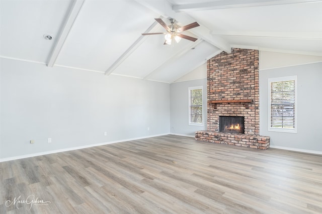 unfurnished living room featuring light wood-type flooring and a healthy amount of sunlight