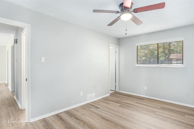 unfurnished room featuring ceiling fan and light hardwood / wood-style flooring