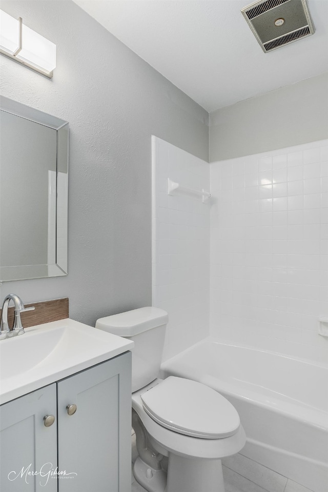 full bathroom with tile patterned flooring, shower / bathtub combination, vanity, and toilet