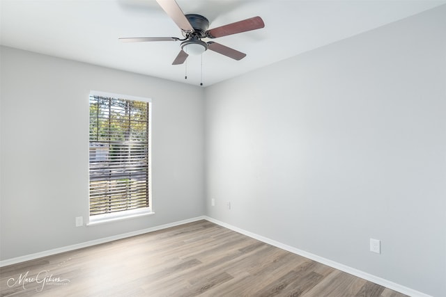 empty room featuring ceiling fan and light hardwood / wood-style flooring